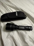 Forrader C8 Cree XM-L2 U3 Tactical Flashlight Resting Next To An Xtar. Fixed Price $39.95.