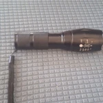 TAC-1200 Black Led Flashlight Zoom Handheld With Wrist Strap. Fixed Price $19.00.
