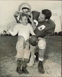 1959 Press Photo Bob Rosbaugh Puts Helmet On Easter Seal Prince Richard Clark. Fixed Price $24.99.